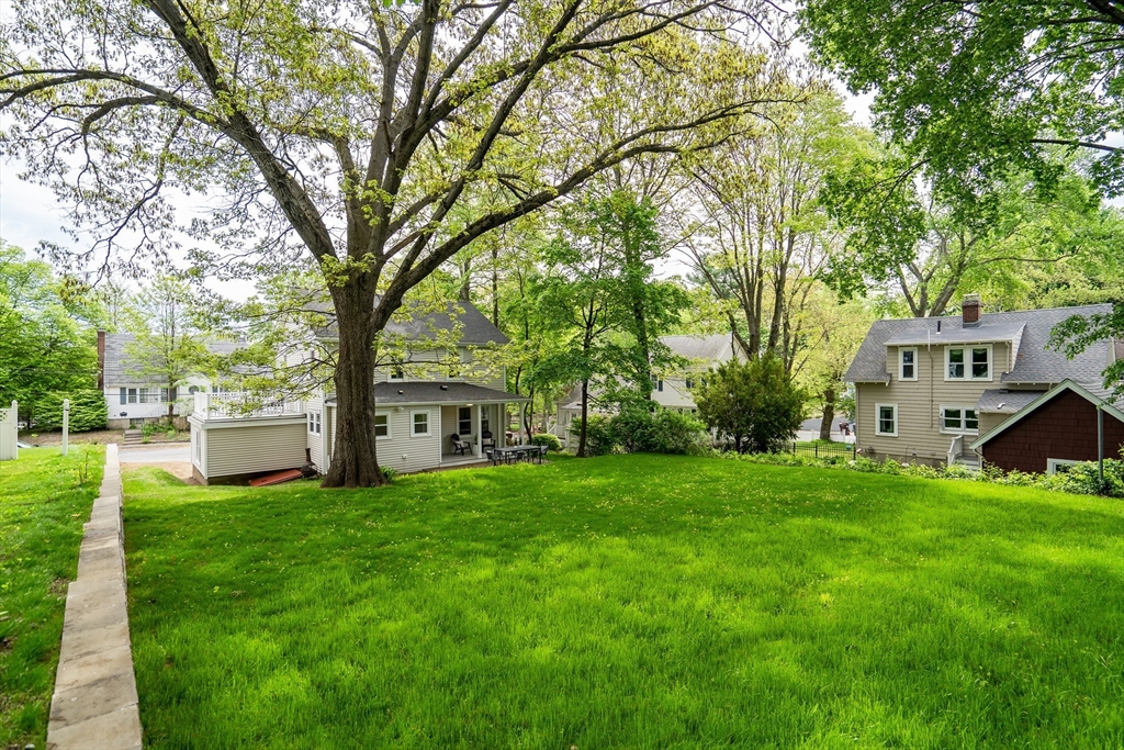 56 Pine Hill Road Dedham, MA 02026 - Photo 31 of 32 a view of a house with a big yard and large trees