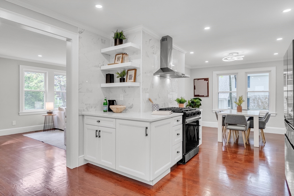 56 Pine Hill Road Dedham, MA 02026 - Photo 10 of 32 a kitchen with white cabinets and wooden floor