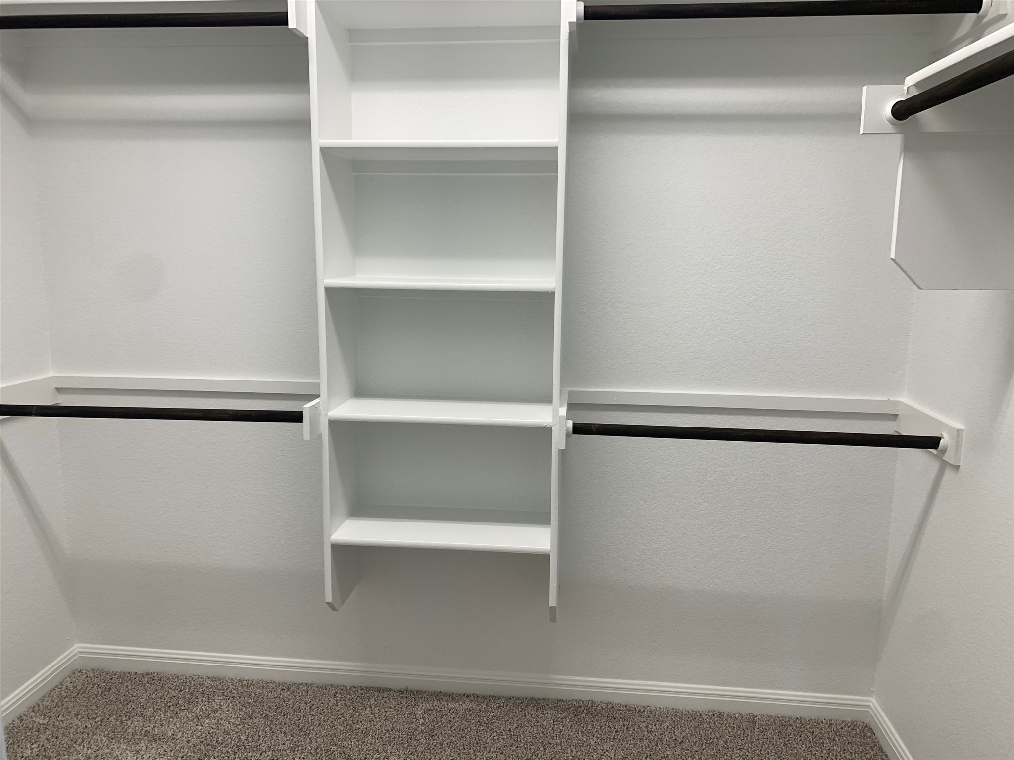 2948 Sage Ranch Drive Leander, TX 78641 - Photo 13 of 28 Functional custom closet system with ample shelving and hanging space.
