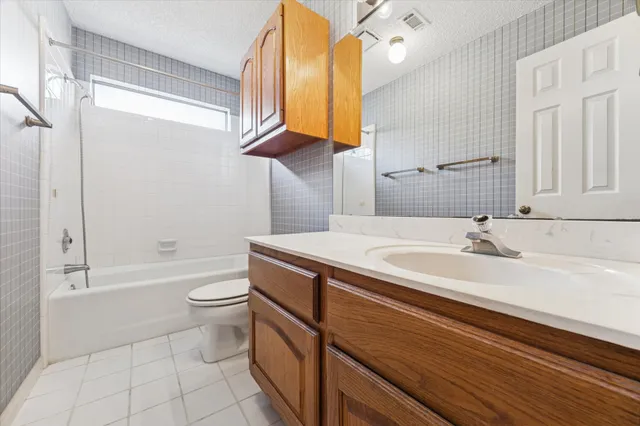 a bathroom with a sink a toilet and a bathtub
