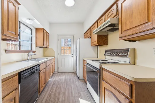 a kitchen with a stove and a sink