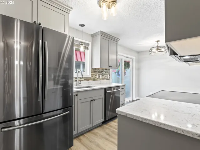 a kitchen with a sink and a window