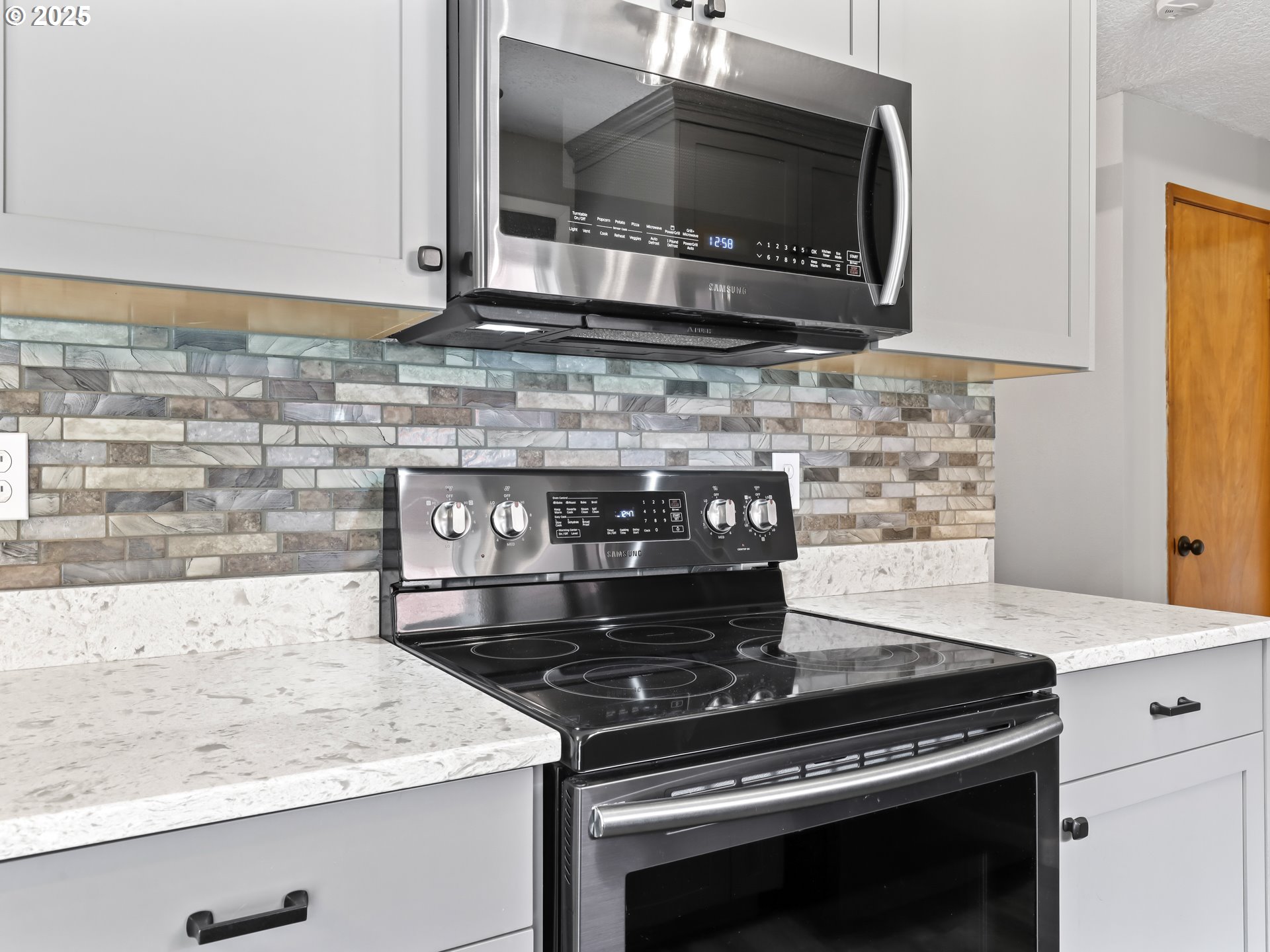 14967 Southeast Grant Court Portland, OR 97233 - Photo 14 of 46 a stove top oven sitting inside of a kitchen