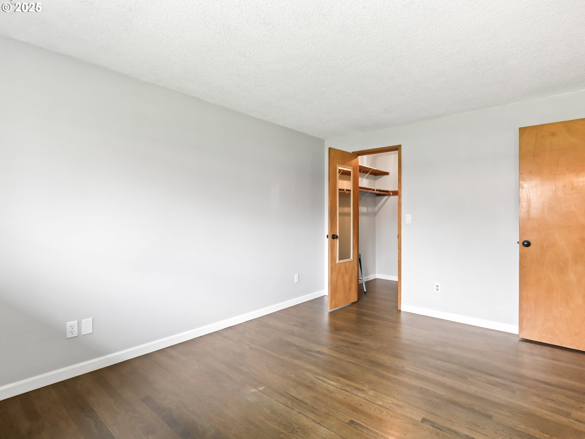 14967 Southeast Grant Court Portland, OR 97233 - Photo 20 of 46 an empty room with wooden floor and closet