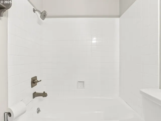 a view of a hallway with washer and dryer