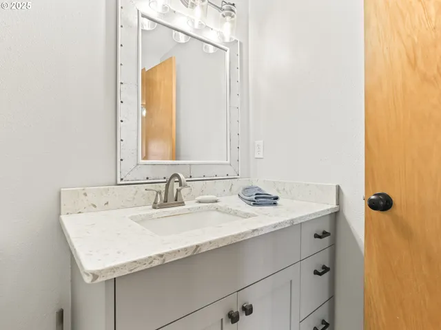 a view of a patio with a table and chairs and potted plants