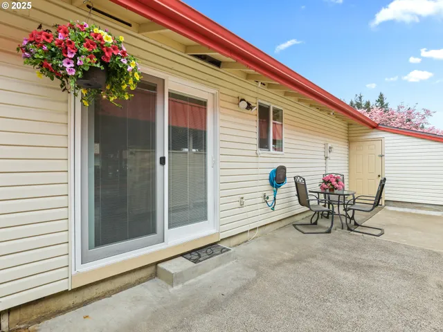 a view of a cars park in front of a building