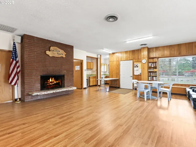 a view of a livingroom with furniture window and wooden floor