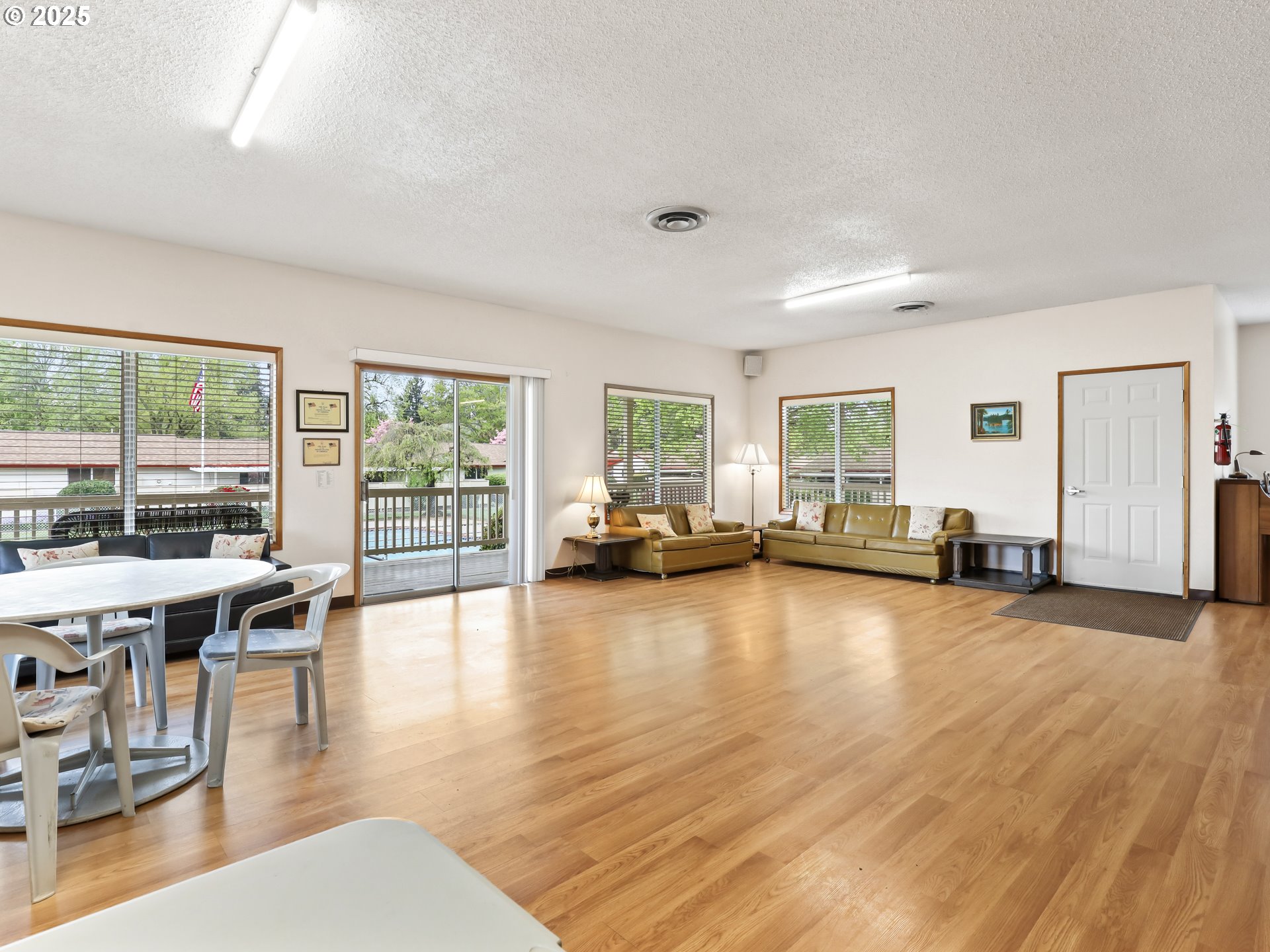 14967 Southeast Grant Court Portland, OR 97233 - Photo 39 of 46 a view of a livingroom with furniture wooden floor and a floor to ceiling window
