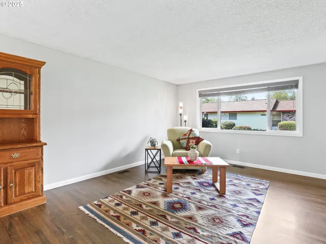 a living room with a rug