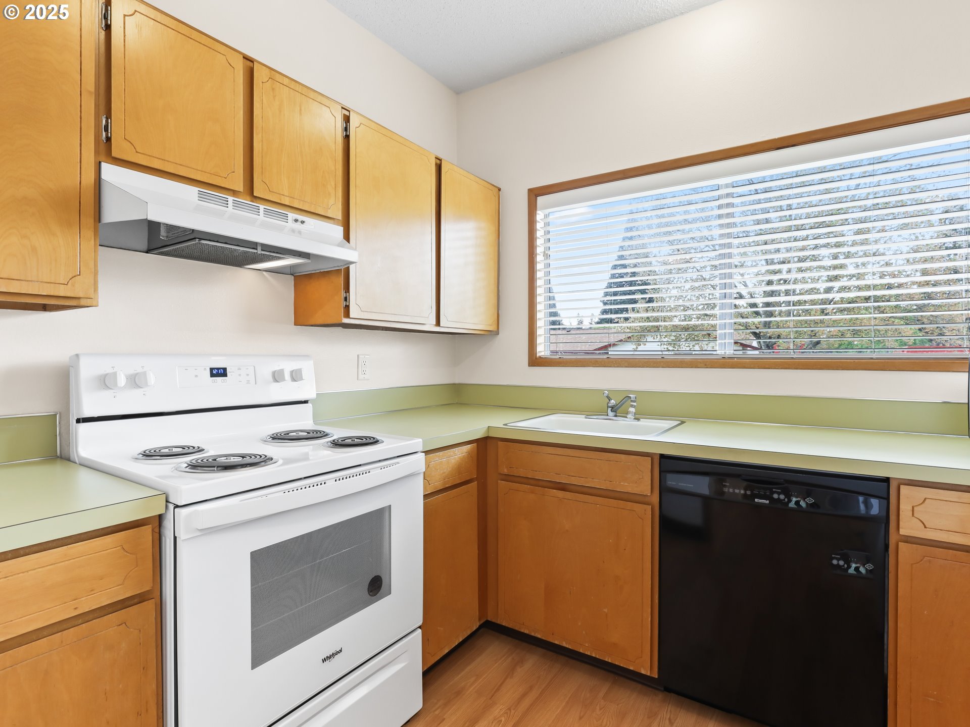 14967 Southeast Grant Court Portland, OR 97233 - Photo 41 of 46 a kitchen with a sink cabinets appliances and a window