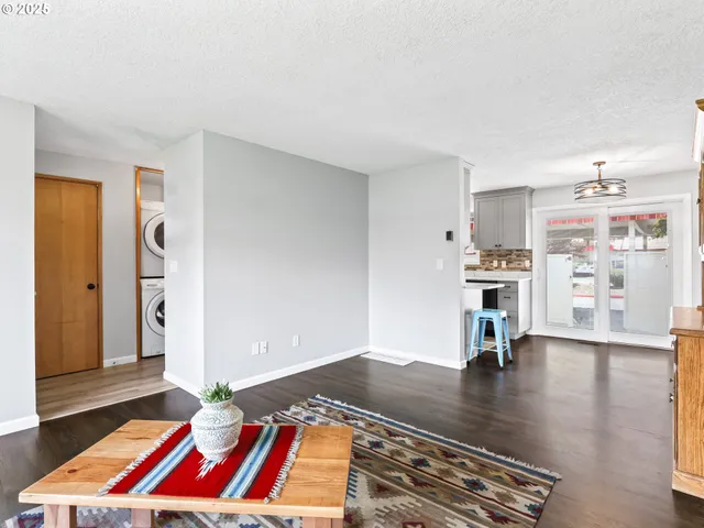 a kitchen with stainless steel appliances a sink stove and refrigerator