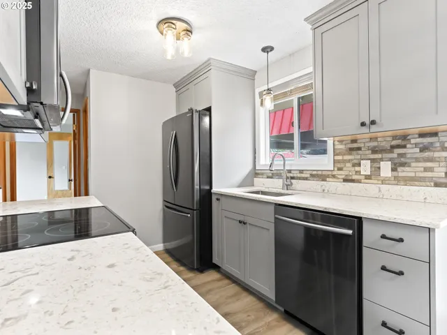 a kitchen with a stove and a microwave