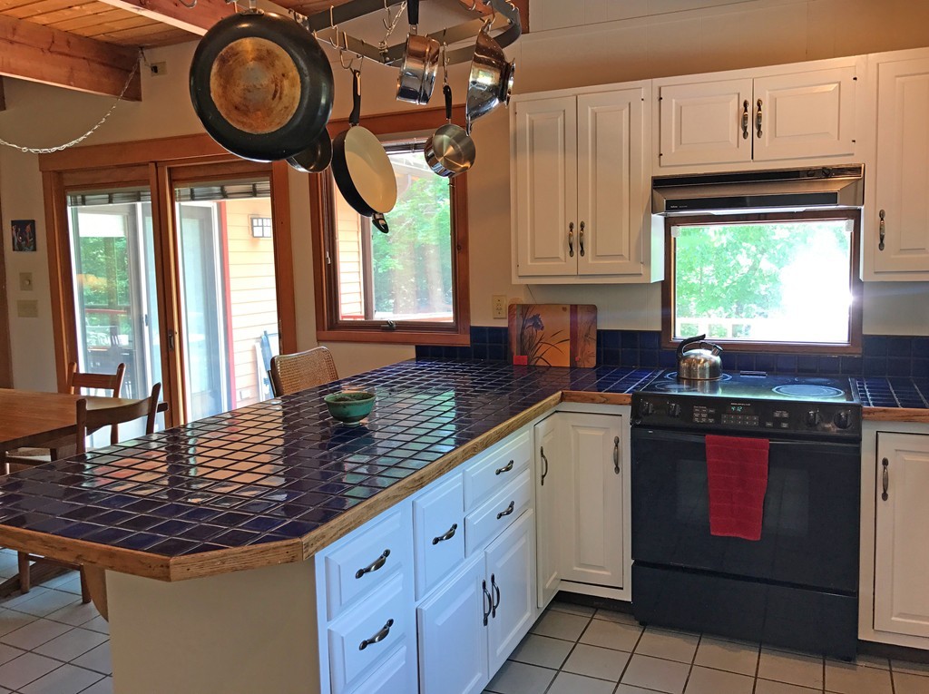 146 Bray Road Buckland, MA 01370 - Photo 16 of 30 a kitchen with stainless steel appliances granite countertop a stove a sink and cabinets