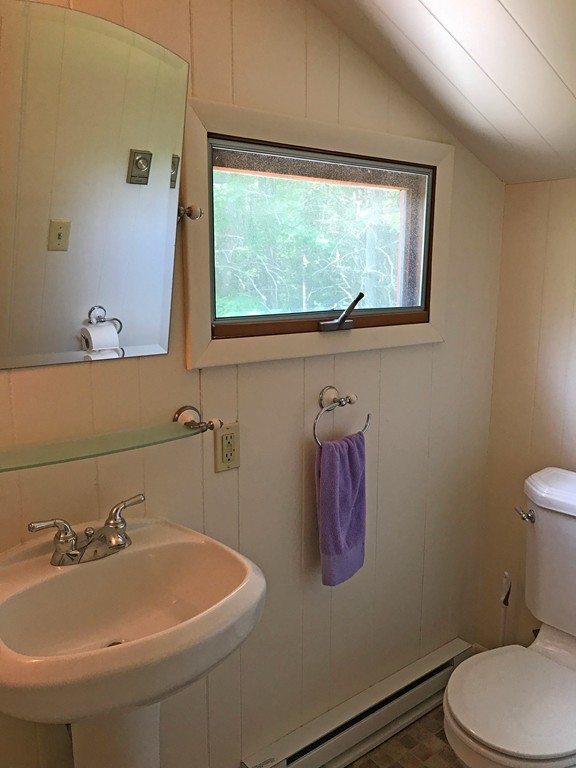 146 Bray Road Buckland, MA 01370 - Photo 22 of 30 a bathroom with a sink a toilet and a window