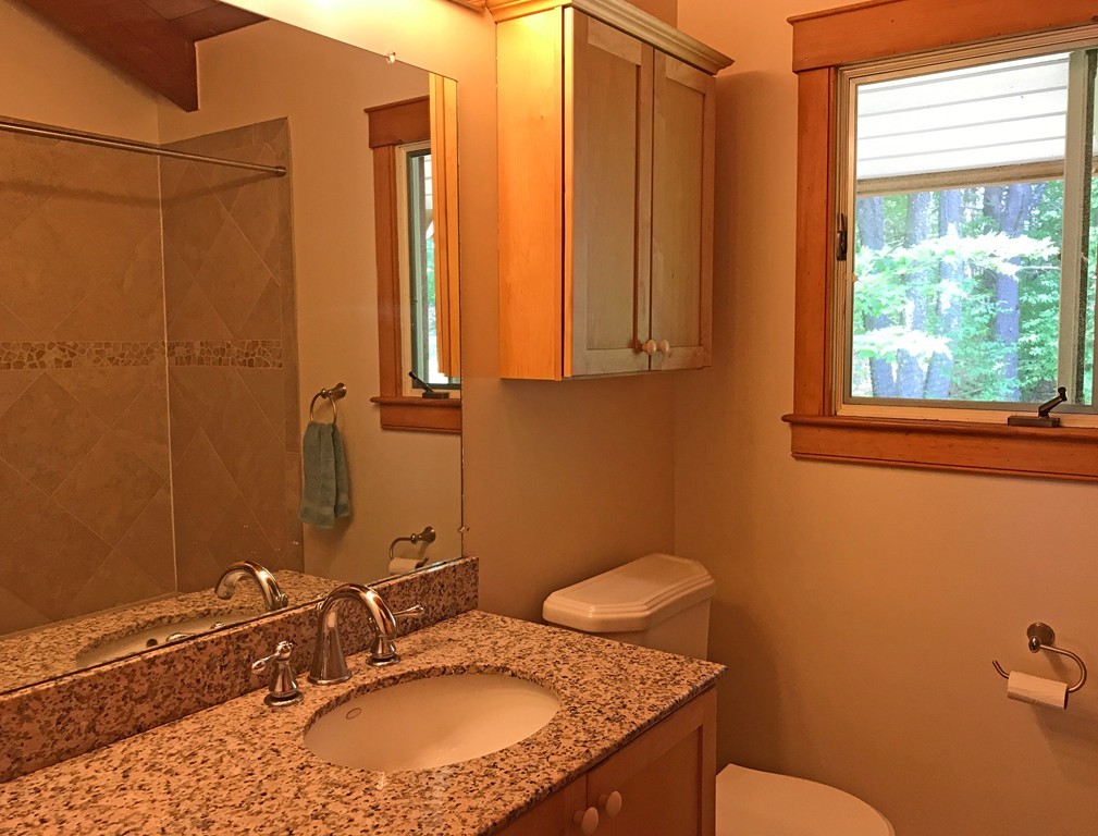 146 Bray Road Buckland, MA 01370 - Photo 25 of 30 a bathroom with a granite countertop sink and a mirror