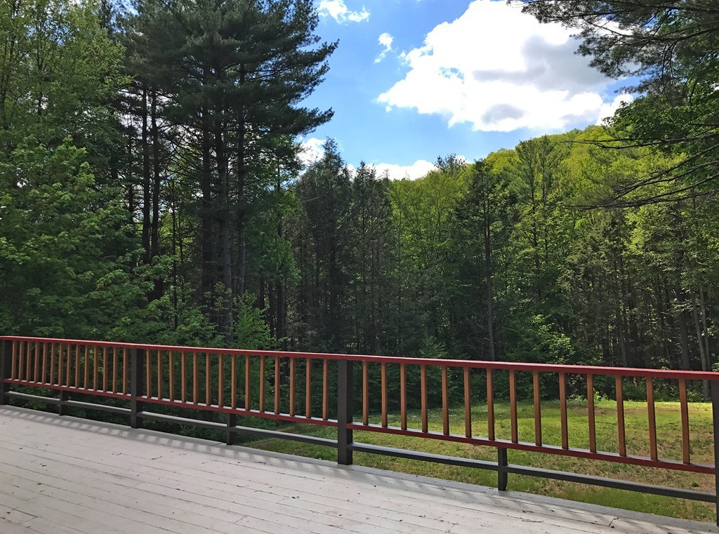 146 Bray Road Buckland, MA 01370 - Photo 4 of 30 a view of balcony with wooden fence and trees