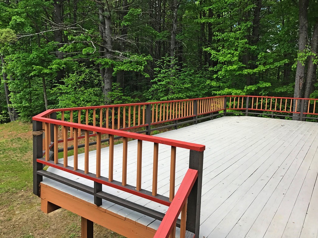 146 Bray Road Buckland, MA 01370 - Photo 5 of 30 a balcony with wooden floor and trees in the background
