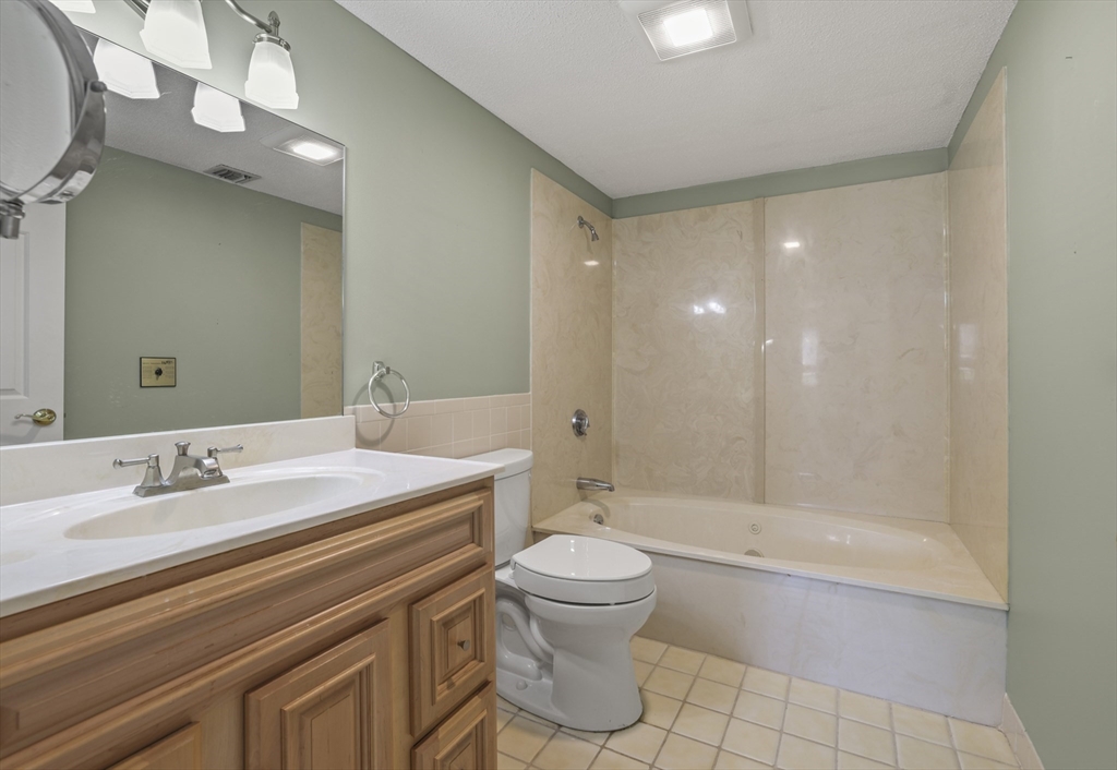 4234 North Main Street, Unit 208 Fall River, MA 02720 - Photo 12 of 27 a bathroom with a sink a toilet and shower