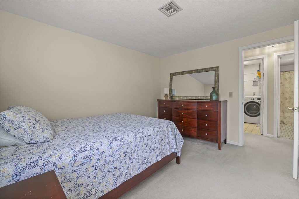 4234 North Main Street, Unit 208 Fall River, MA 02720 - Photo 14 of 27 a bedroom with a bed and a dresser