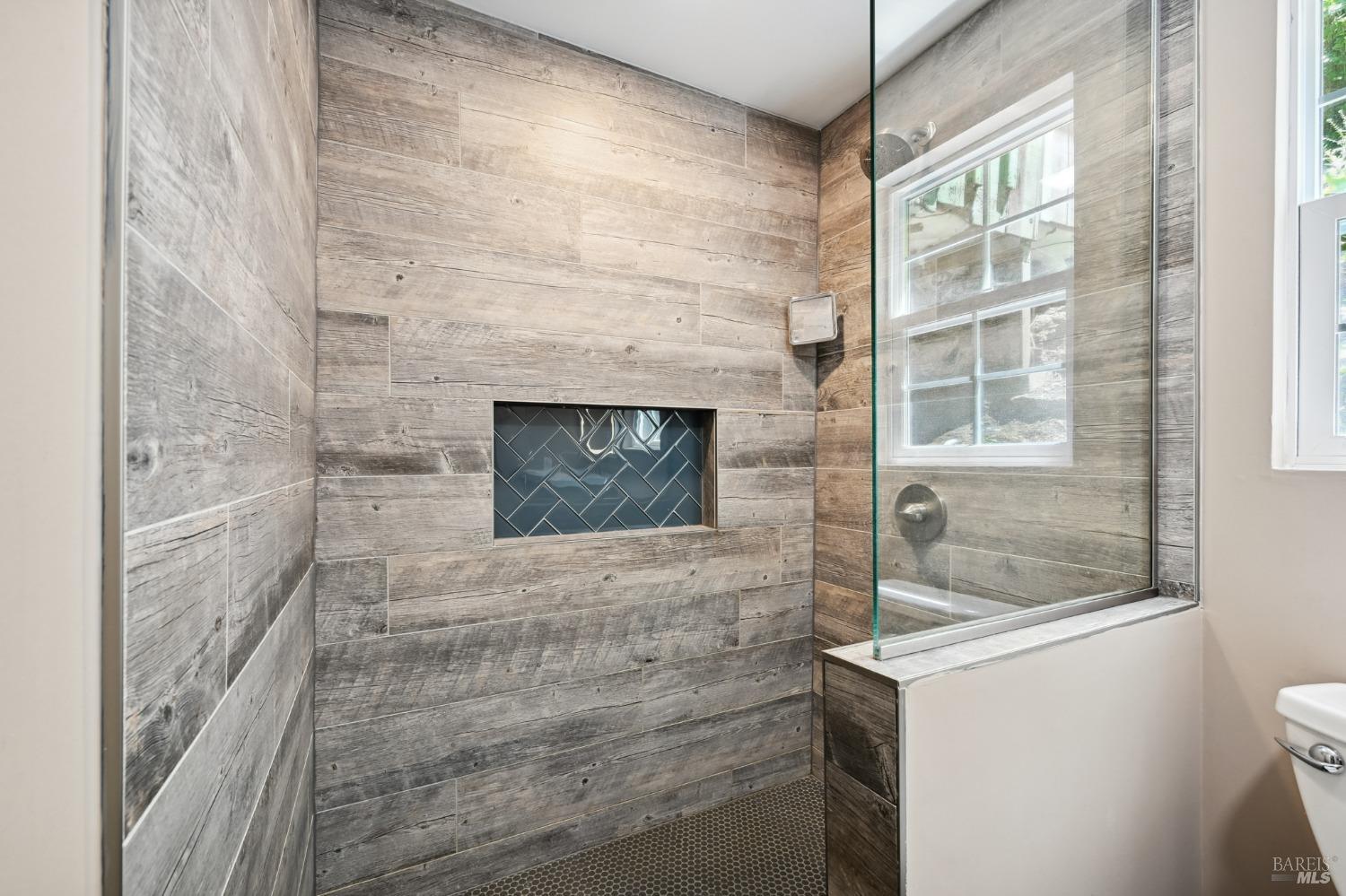 21713 Starrett Hill Drive Monte Rio, CA 95462 - Photo 31 of 50 a bathroom with a shower and a mirror