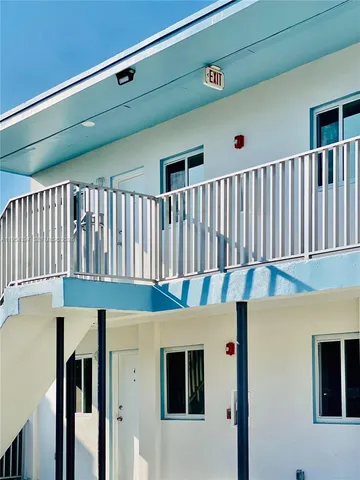 a kitchen view with a refrigerator and a stove