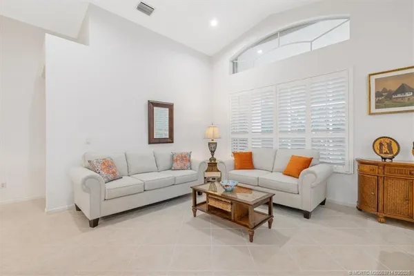 a white bath tub sitting next to a shower