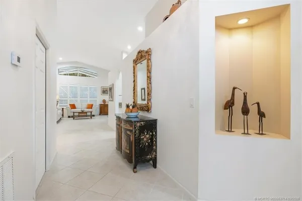 a kitchen with granite countertop a sink stove and refrigerator