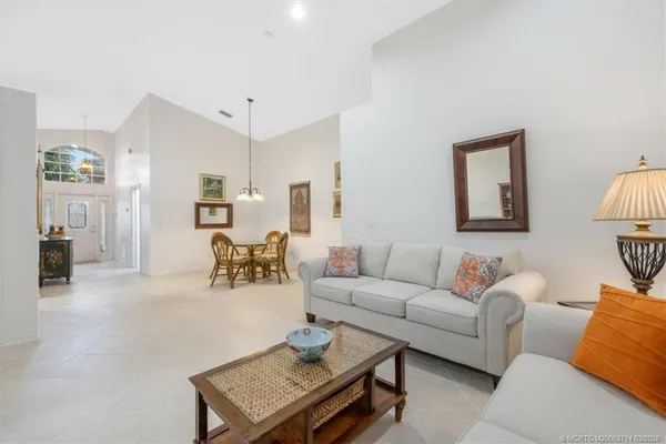 a kitchen with refrigerator and cabinets