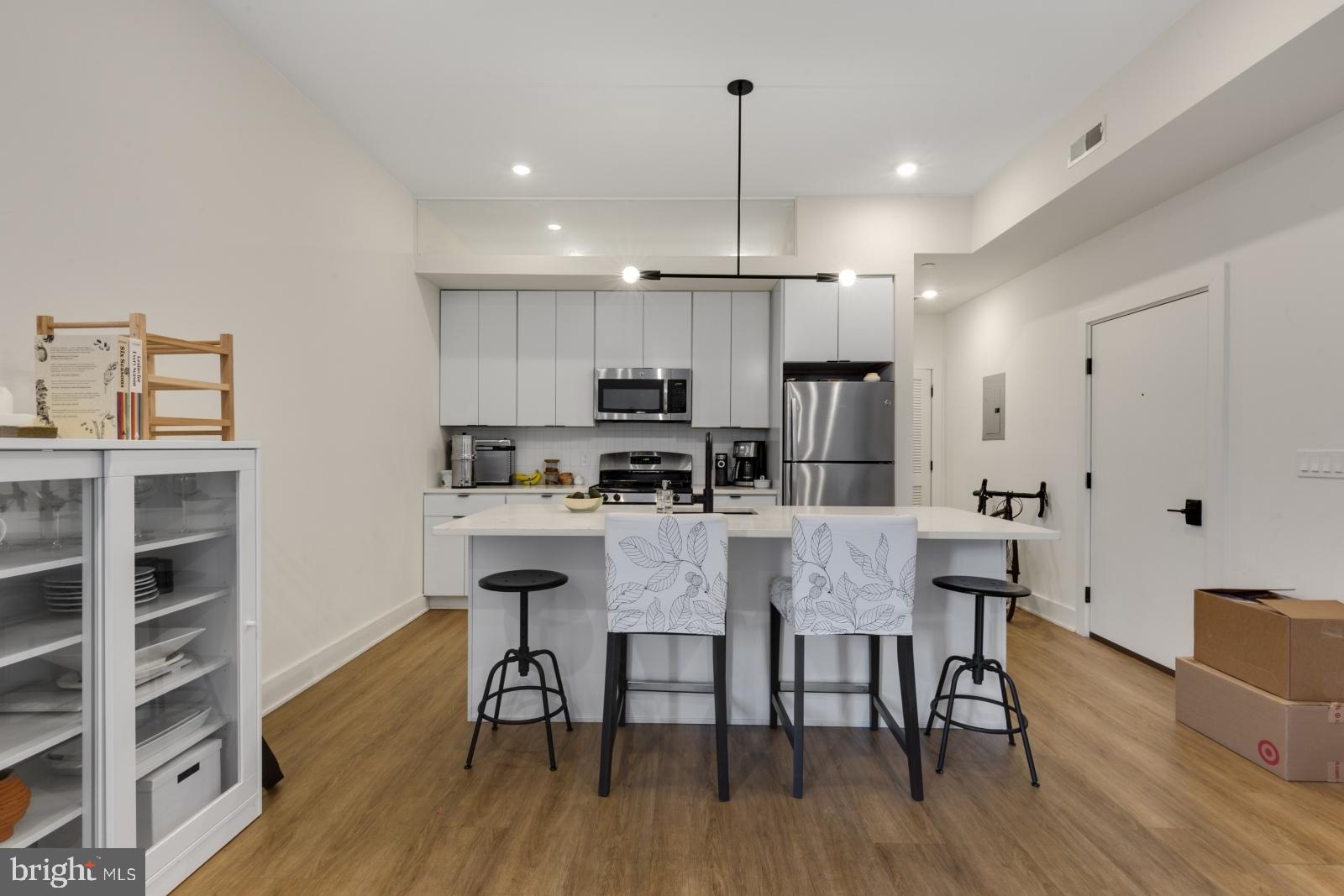 a view of kitchen with dining table and chairs
