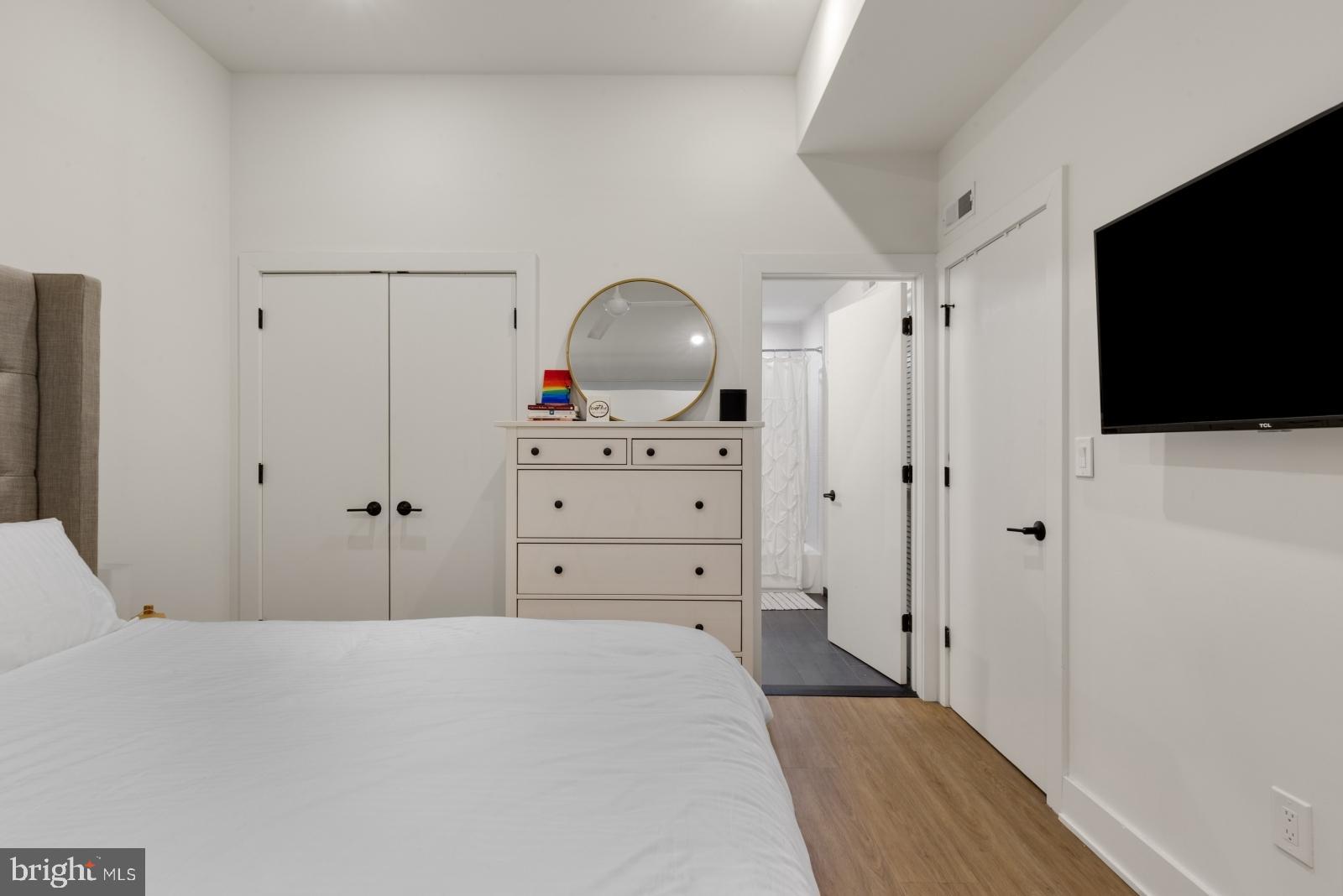 630 Federal Street, Unit 304 Philadelphia, PA 19147 - Photo 14 of 26 a bedroom with a bed and a flat screen tv
