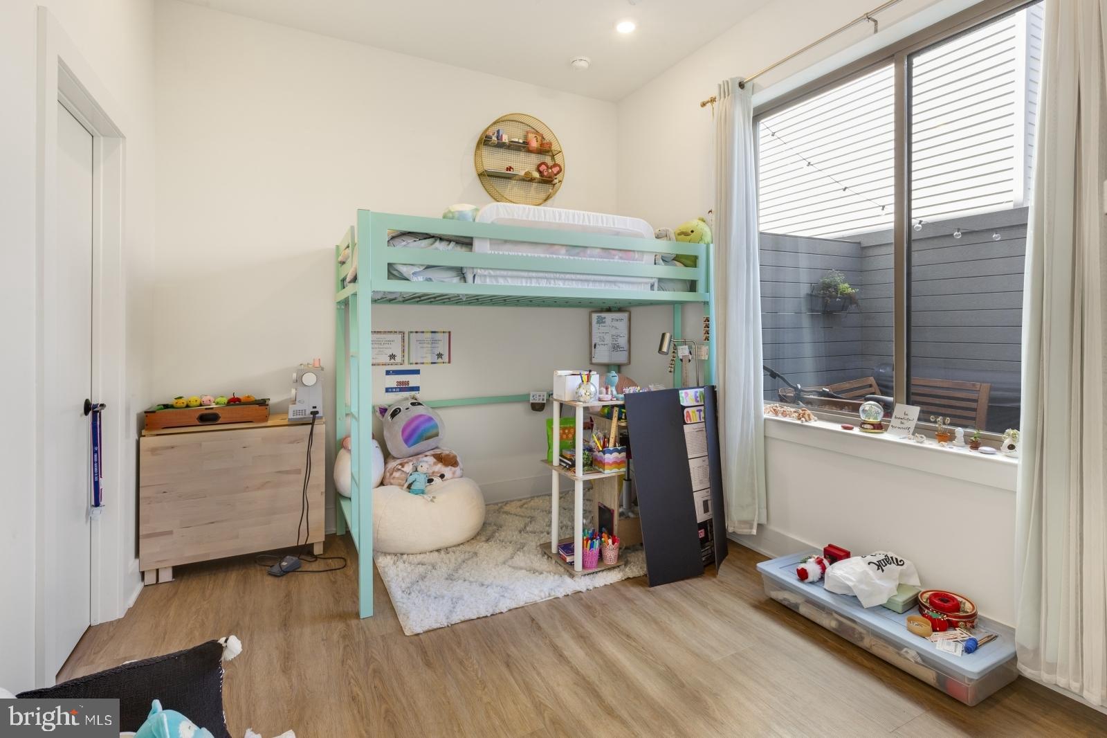 630 Federal Street, Unit 304 Philadelphia, PA 19147 - Photo 17 of 26 a room with toys and a wooden floor