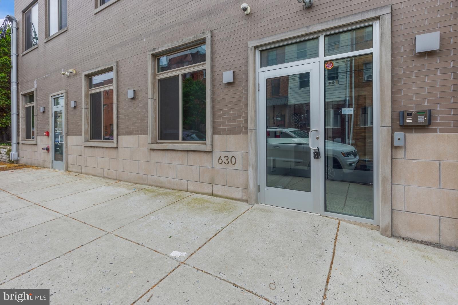 630 Federal Street, Unit 304 Philadelphia, PA 19147 - Photo 26 of 26 front view of a brick house with a glass door