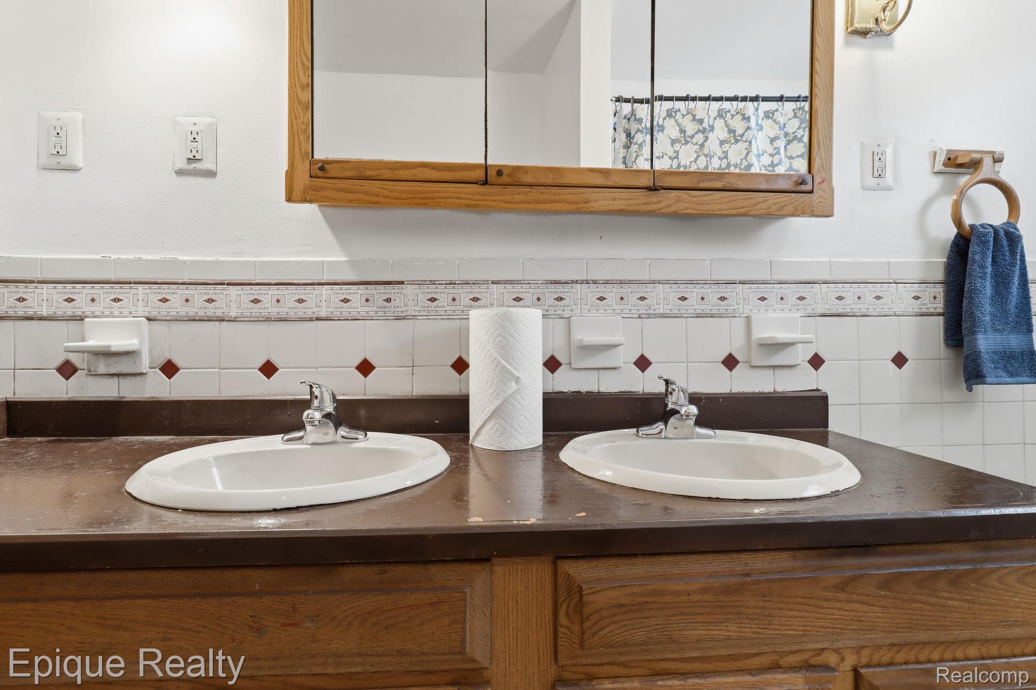 5834 Wayne Road Romulus, MI 48174 - Photo 14 of 15 Bathroom featuring double vanity and wainscoting