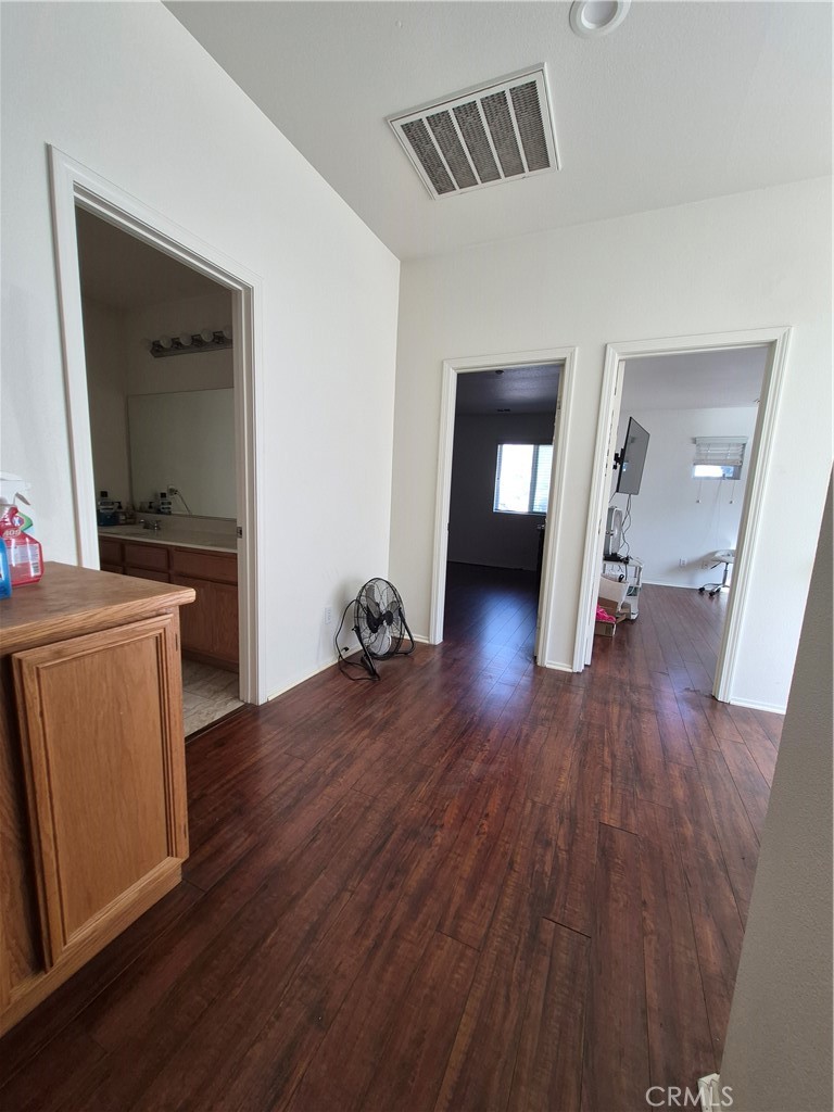 1785 Catania Drive Riverside, CA 92507 - Photo 21 of 47 Landing upstairs with built in Cabinets. Area is large enough to put a desk or shelves.