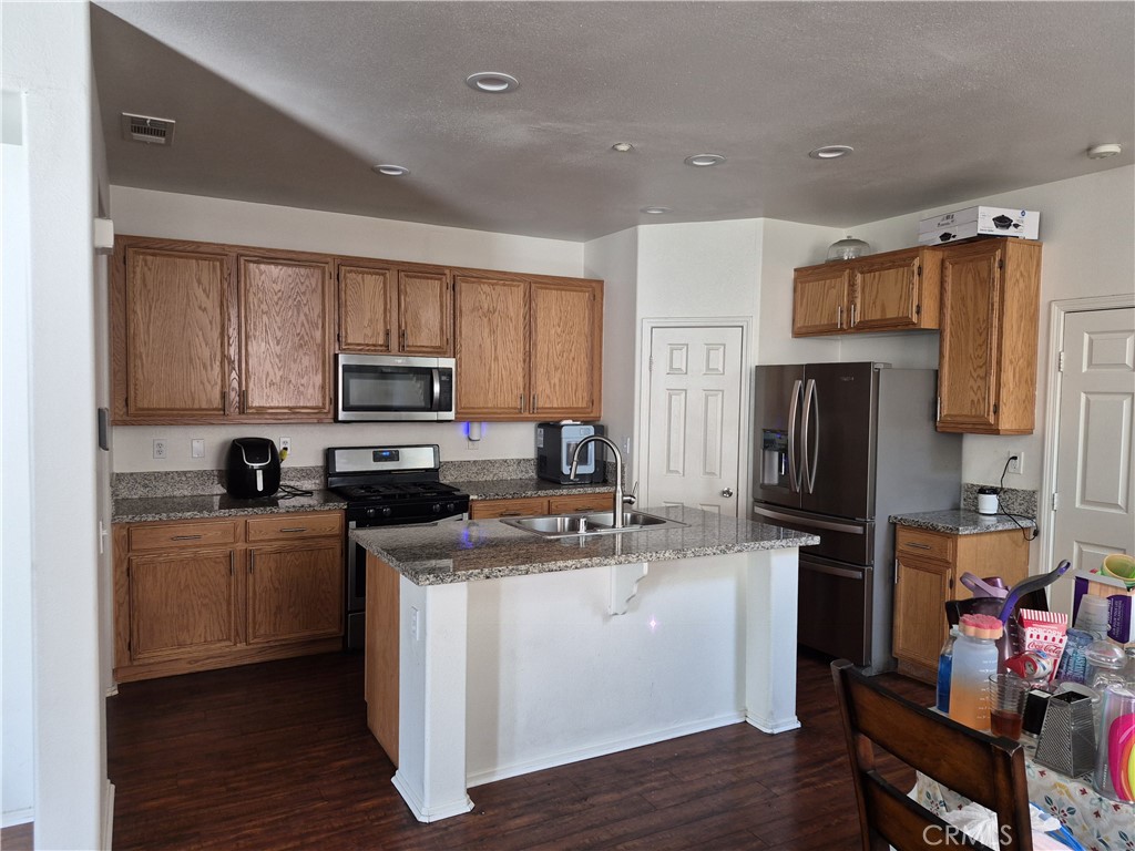 1785 Catania Drive Riverside, CA 92507 - Photo 6 of 47 Large Kitchen. Island. Stainless Steel Appliances. Walk in Pantry.
