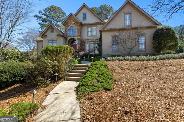 a front view of a house with garden