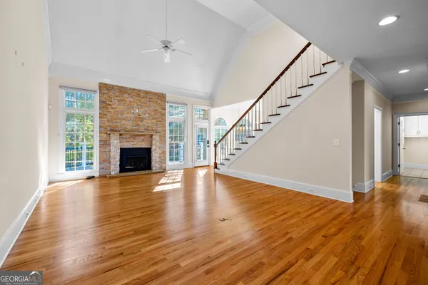 a kitchen with white cabinets and a stove