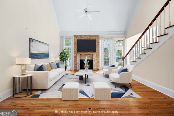 a large kitchen with stainless steel appliances granite countertop a lot of counter space and wooden floors