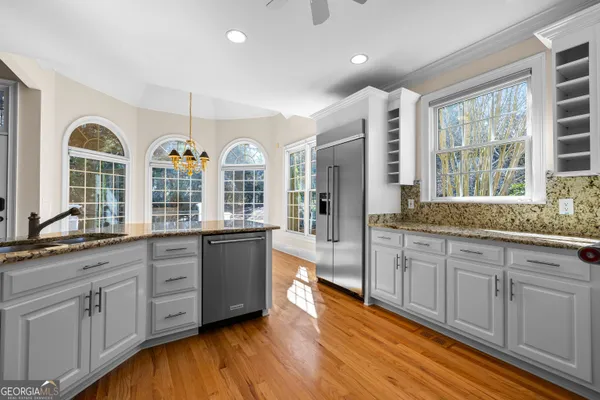 a view of kitchen with cabinets and wooden floor