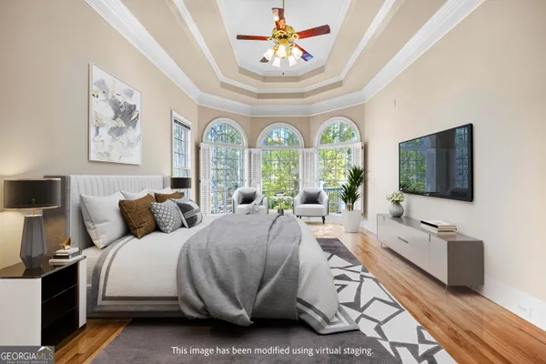 a bathroom with a tub shower and mirror