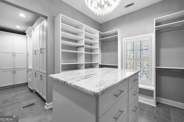 a bathroom with a granite countertop sink mirror and a