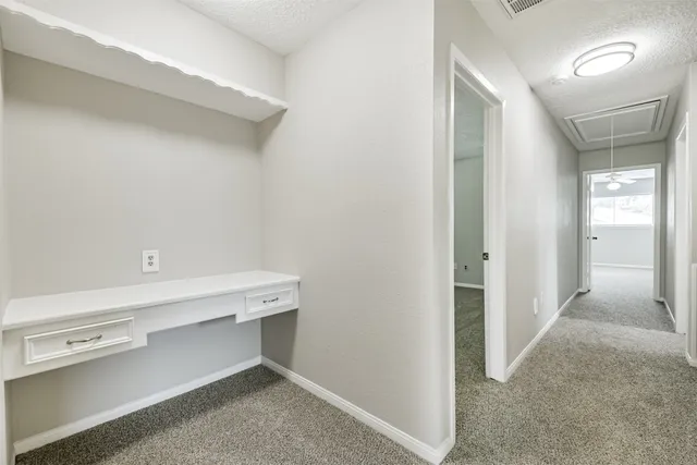 a bedroom with a bed dresser and a window