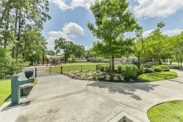 a view of outdoor space with playground and green space