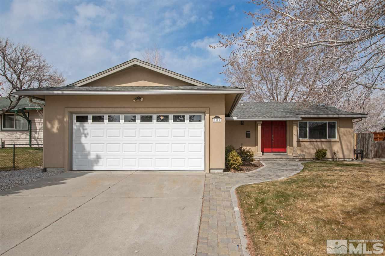 2575 Valmar Place Reno, NV 89503 - Photo 3 of 34 a front view of a house with a yard and garage