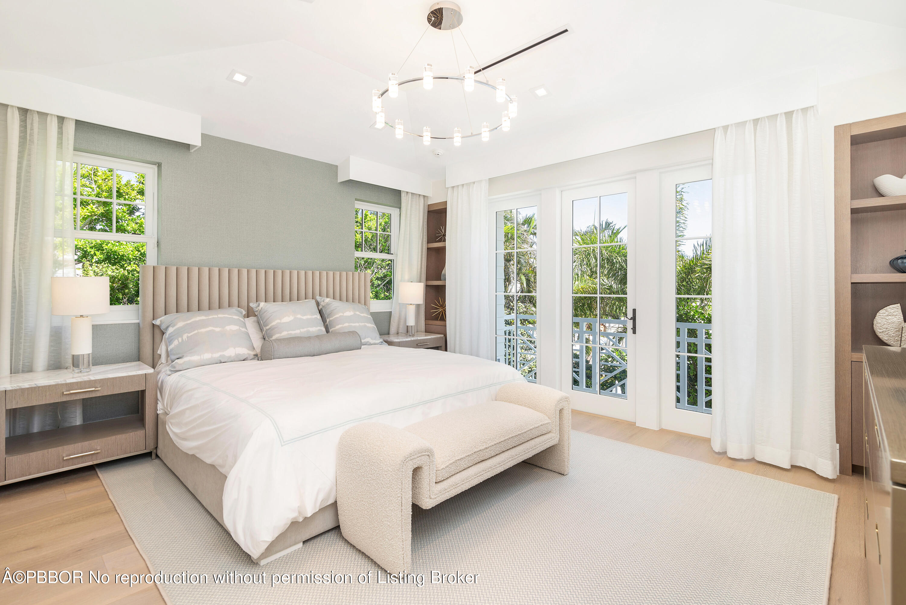 223 Monterey Road Palm Beach, FL 33480 - Photo 31 of 44 a bedroom with a large bed and a chandelier