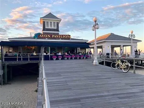a view of a cafe with sitting area