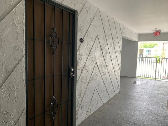 a view of a closet area with wooden floor and windows