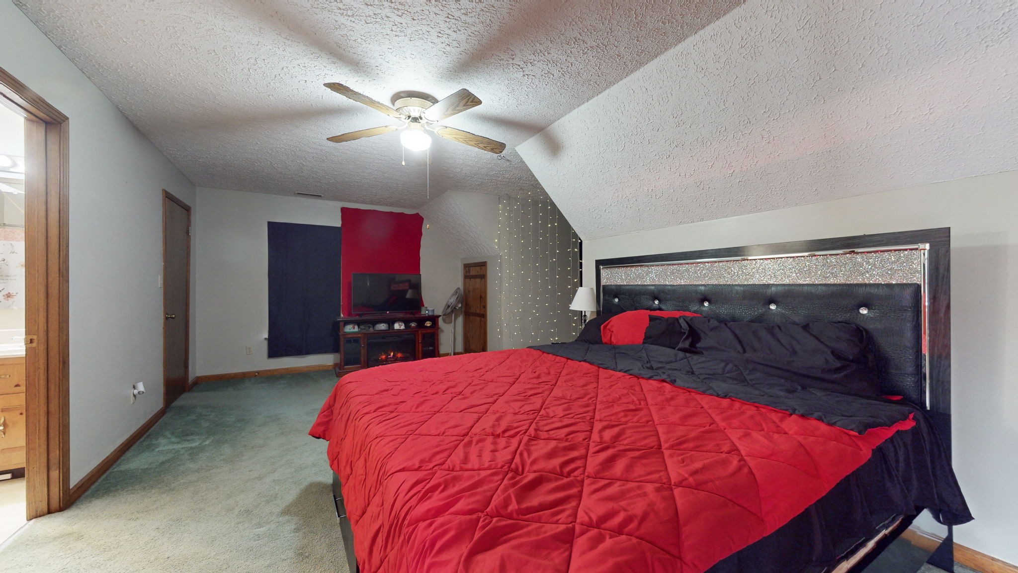 2459 Toler Road Woodlawn, TN 37191 - Photo 13 of 48 a bed room with a bed and a mirror