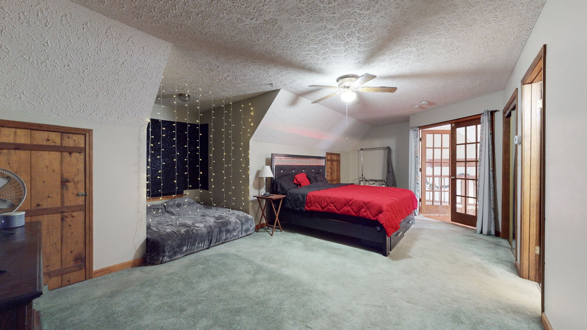 2459 Toler Road Woodlawn, TN 37191 - Photo 15 of 48 a spacious bedroom with a bed mirror and window